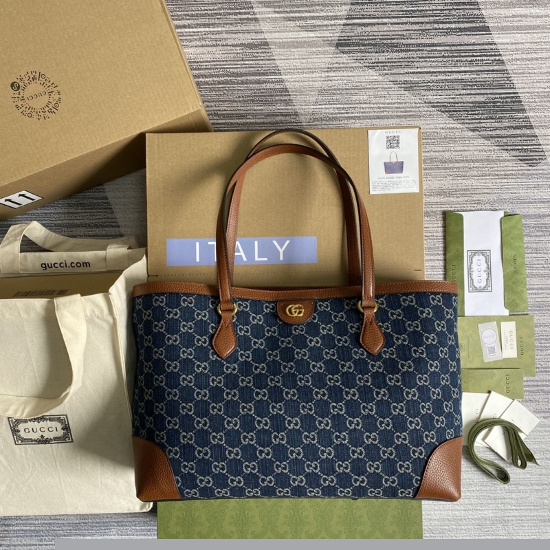G*u*i shopping bags
